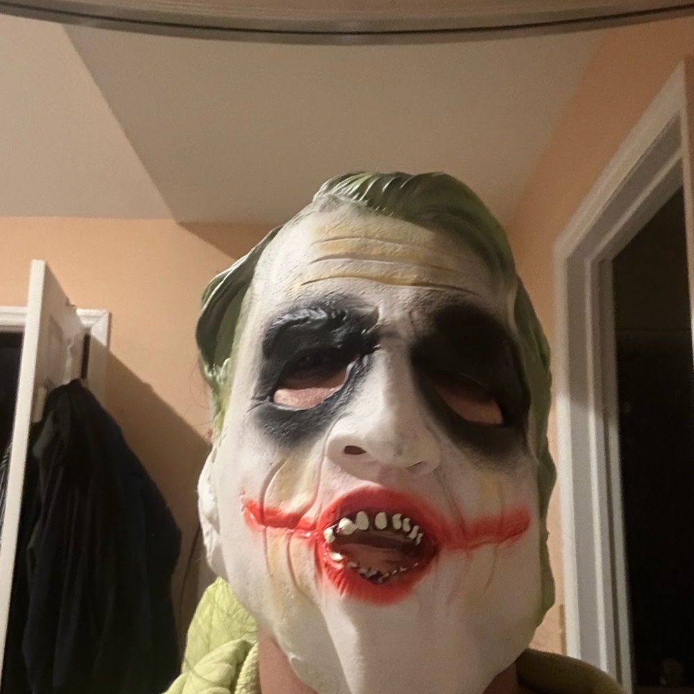 Bundle of joker mask and multiple Disney hats